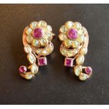 A Pair of 14 Carat Gold Ear Clips of Flower Head form, each set with three rubies and chrysoberyl