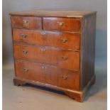 A George II Walnut Chest, the moulded top above two short and three long graduated drawers with
