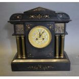A Victorian Black Slate Mantel Clock, the filigree brass dial with Arabic numerals and two train