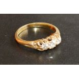 An 18 Carat Gold Three Stone Diamond Ring, the three graduated stones claw set