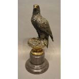 A Patinated Bronze Model in the Form of an Eagle upon a variegated marble socle, 32cm tall