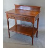 An Edwardian Mahogany Satinwood Inlaid Side Table with a low galleried back above a frieze drawer