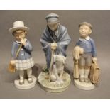 A Royal Copenhagen Porcelain Model in the Form of a Boy with Suitcase, number 4528, together with