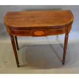 A 19th Century Mahogany Card Table, the crossbanded top enclosing a baize lined interior above an