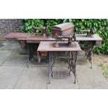 A Collection of Three Early Singer Sewing Machines with iron bases