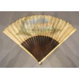 An Early 18th Century German Fan, hand painted with figures within a landscape with shaped wooden