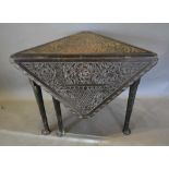 A 19th Century Carved Oak Drop Flap Table of Triangular Form, retailed by Edwards & Roberts