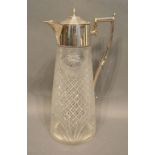 An Edwardian Silver Plated and Cut Glass Claret Jug with shaped handle, 28cm tall
