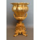 A French Ormolu Two Handed Jardiniere upon a shaped plinth with scroll feet, 37cm tall