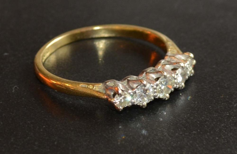 An 18 Carat Gold Five Stone Diamond Ring, the five graduated stones claw set