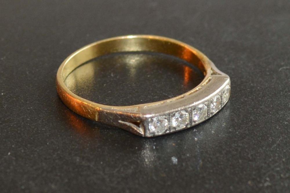 A Yellow Metal Five Stone Diamond Ring of band form