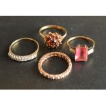 A 9 Carat Gold Garnet Cluster Ring, together with three other 9 carat gold dress rings