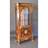 A French Kingwood and Walnut Gilt Metal Mounted Vitrine with a single door enclosing glass shelves