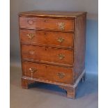 A 19th Century Oak and Pine Chest, the moulded top above four drawers with brass handles raised upon