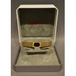A Certina Ladies Wristwatch, gold plated, the black dial set single diamond, within original box,