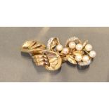 A Gold Brooch Set with Pearls and Diamonds and with hinged parts, 7.5cm long