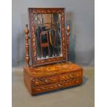 A 19th Century Dutch Marquetry Inlaid Dressing Mirror, the rectangular swing plate above a three