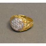 An 18 Carat Gold Diamond Cluster Ring, set many diamonds within a circular setting