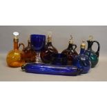 A Collection of Six Coloured Glass Decanters, together with a Bristol blue glass rolling pin and two