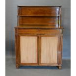 A Regency Rosewood Chiffonier with a brass galleried shelf back above a frieze drawer and a pair
