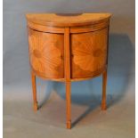 A 19th Century Sheraton Revival Satinwood Demi Lune Side Cabinet with an inlaid top above two