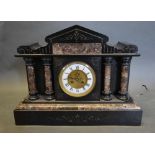 A Victorian Black Slate and Rouge Marble Mounted Mantel Clock, the enamel dial with Roman numerals