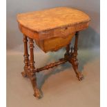 A Victorian Walnut Marquetry Inlaid Work Table, the hinged top above a shaped inlaid frieze and with