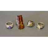 A Group of Four Silver Dress Rings