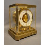 A Le Coultre Atmos Clock with brass and glass case and white dial, no 127863