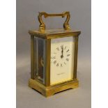 A Brass Cased Carriage Clock retailed by Mappin & Webb, the enamel dial with Roman numerals and with