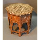 A Moorish Inlaid Octagonal Occasional Table with folding stand, 55cm diameter