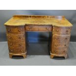 A Victorian Walnut Twin Pedestal Desk with a low galleried back above three drawers and two cupboard
