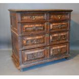 A 17th Century Oak and Walnut Two Part Moulded Chest of two short and three long drawers with