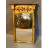 A 19th Century Gilded Pier Glass, the frieze decorated in relief and with half columns, 81 x 53cm