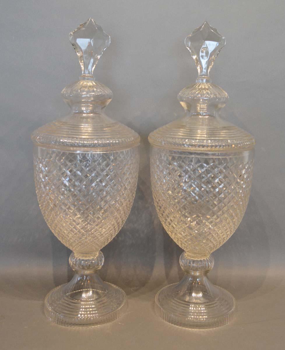 A Pair of Cut Glass Large Covered Vases of oviform with circular pedestal bases, 56cm tall