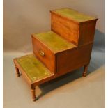 A Regency Mahogany Library Step with three tooled leather steps raised upon turned legs