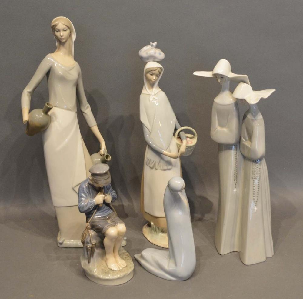 A Lladro Figurine of Two Nuns, together with two other Lladro figurines, a Royal Copenhagen figurine