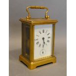 A French Brass Cased Carriage Clock, the enamel dial with Roman numerals and subsidiary alarms