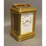 A 19th Century French Brass Gorge Cased Carriage Clock, the enamel dial with Roman and Arabic