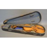 A German Violin with two piece back and ebony fretboard, bearing label 'Copy of a Stradivarius',