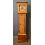 A Pine Longcase Clock with a square hood above a rectangular door and conforming plinth base, the