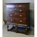 A George III Oak Chest on Stand, the moulded top above two short and three long graduated drawers