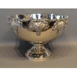 A Silver Plated Large Punch Bowl decorated in relief with grapevines and circular pedestal base,