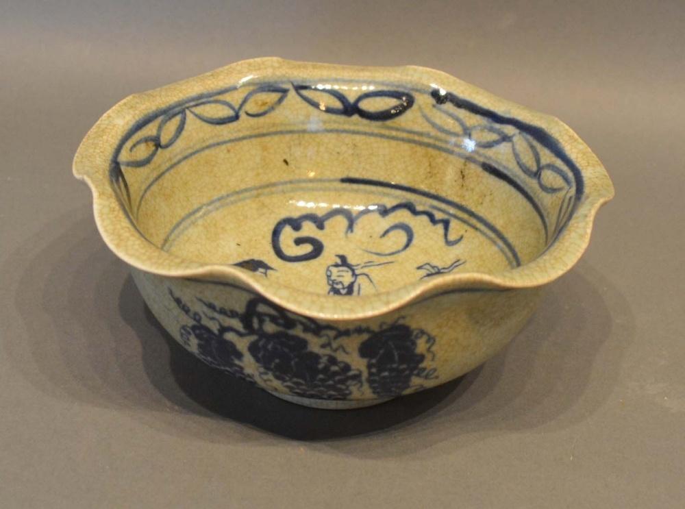 A Chinese Crackleware Underglaze Blue Decorated Bowl with a flared rim and circular foot, 18cm