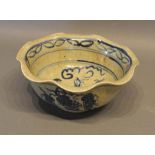 A Chinese Crackleware Underglaze Blue Decorated Bowl with a flared rim and circular foot, 18cm