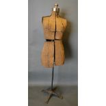 An Early Tailor's Dummy with wrought iron stand, 150cm tall
