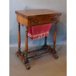 A William IV Rosewood Games Work Table, the folding hinged top enclosing a baize lined interior