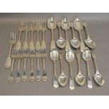 A Mixed Canteen of Silver Flatware comprising twelve forks and twelve spoons ranging from Georgian