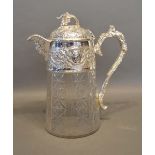 A Silver Plated and Glass Claret Jug with figurehead spout and cut glass body and with grapevine