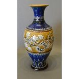 A Doulton Lambeth Vase decorated by Eliza Simmance, relief decorated with a foliate scroll upon a